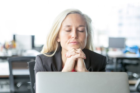 Concentrated businesswoman taking decisionの写真素材