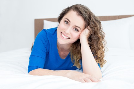 Happy Charming Woman Resting on Bed