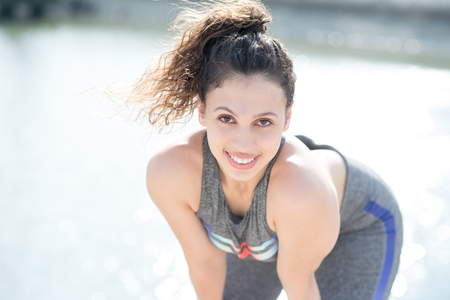 Closeup of Smiling Sporty Pretty Woman Outdoorsの写真素材