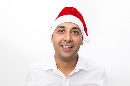 Closeup of Happy Man Wearing Santa Claus Hatの写真素材