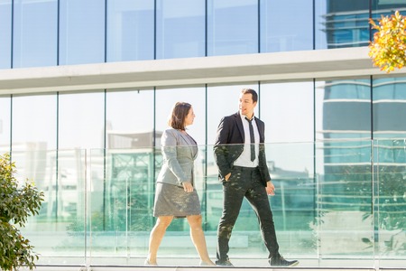 Relaxed Business Colleagues Walking Outsideの写真素材