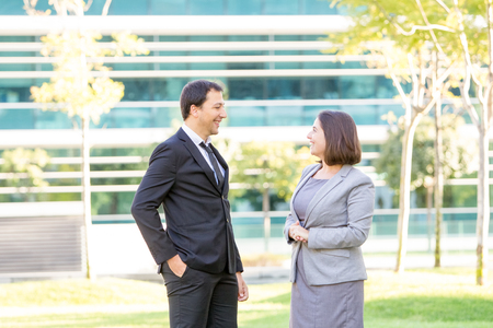 Relaxed Business Man and Woman Chatting Outdoorsの写真素材