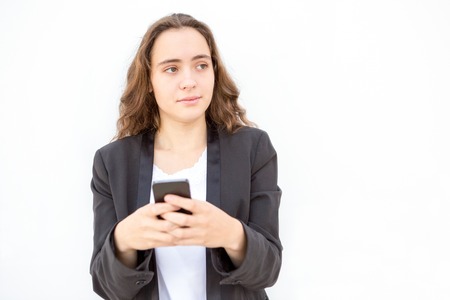 Concentrated female manager thinking of messageの写真素材