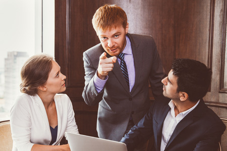 Young Businessman Pointing to Cameraの写真素材