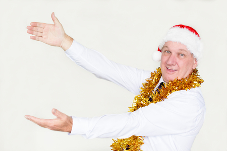 Cheerful male manager advertising Christmas itemの写真素材