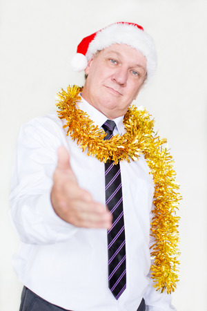 Confident man in Christmas costume handshakingの写真素材