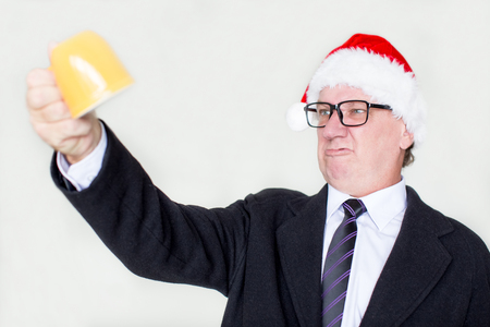 Angry businessman shaking empty mugの写真素材