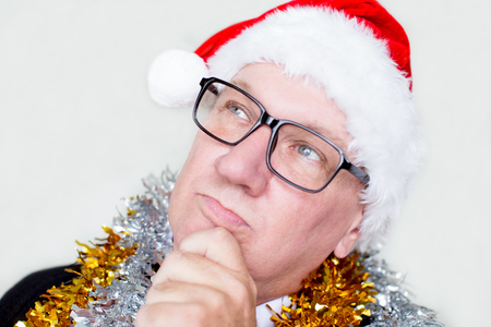 Thoughtful enterprising manager in Santa costumeの写真素材