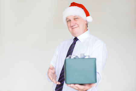 Content Business Man in Santa Hat Giving Giftの写真素材