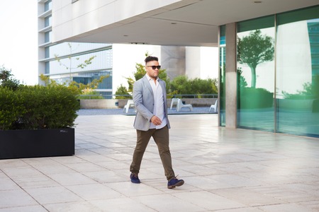 Handsome young businessman going to workの写真素材