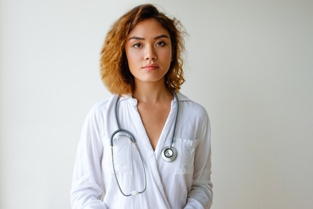 Portrait of confident young Asian female doctorの写真素材