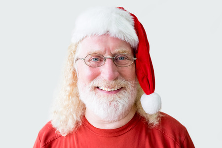Portrait of Smiling Senior Man in Christmas Hatの写真素材