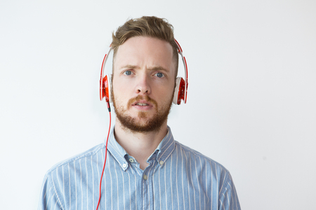 Portrait of Surprised Young Man in Headphoneの写真素材