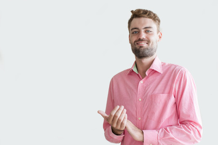 Portrait of Content Young Man Applauding at Cameraの写真素材