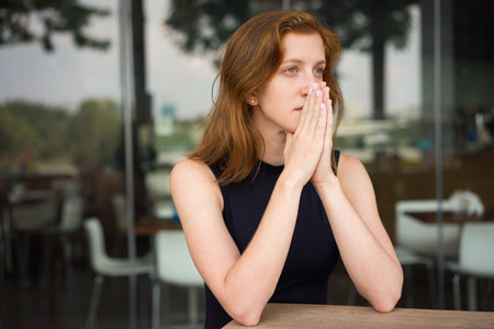 Nervous Woman Waiting Partner for Important Meetingの写真素材