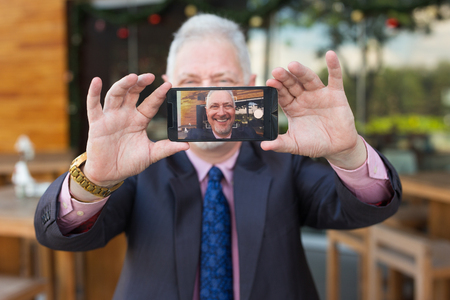 Happy Business Man Taking Selfie Photo Outdoorsの写真素材