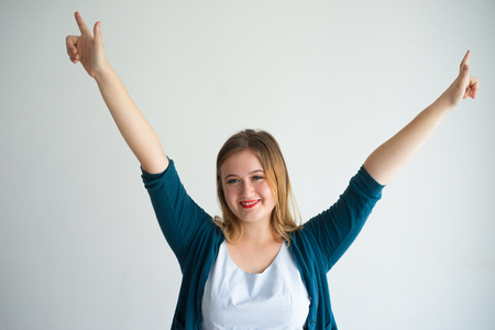 Joyful Young Beautiful Woman Celebrating Successの写真素材