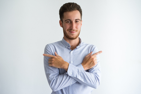 Smiling businessman showing different directionsの写真素材
