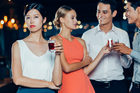 Four Young People Celebrating and Toasting in Barの写真素材
