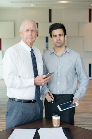 Two Serious Businessmen Looking at Cameraの写真素材