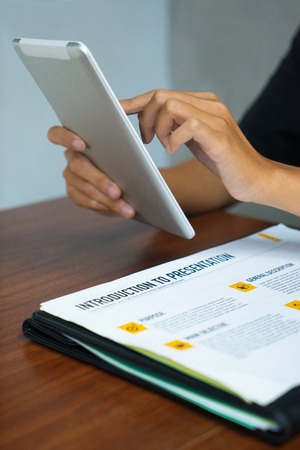 Female manager using digital tablet in office