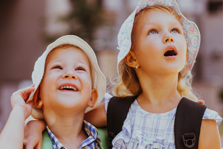 Closeup of Amazed Little Girl and Boy Huggingの写真素材