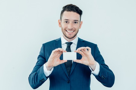 Successful financial advisor showing blank cardの写真素材