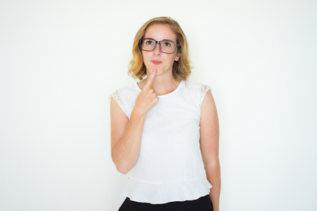 Pensive Beautiful Young Woman Touching Chinの写真素材