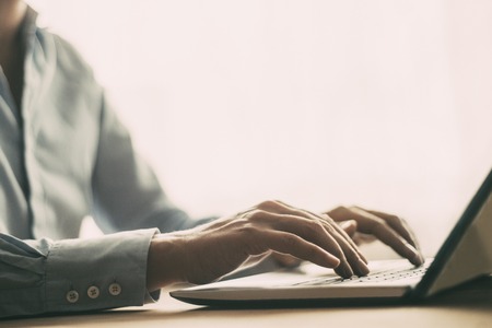 Closeup of Employee Typing on Laptop Computer
