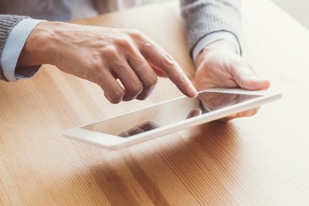 Closeup of Woman Using Touchpad at Table