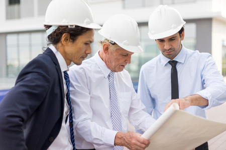 Architects Discussing Project at Construction Siteの写真素材