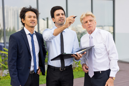 Partners Discussing Issues at Construction Siteの写真素材