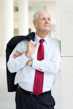 Pensive Senior Company Owner in Urban Backgroundの写真素材