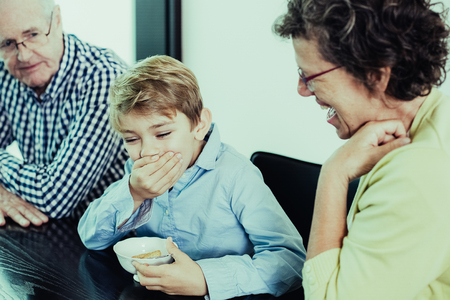 Grandson and Grandparents Chatting and Laughing