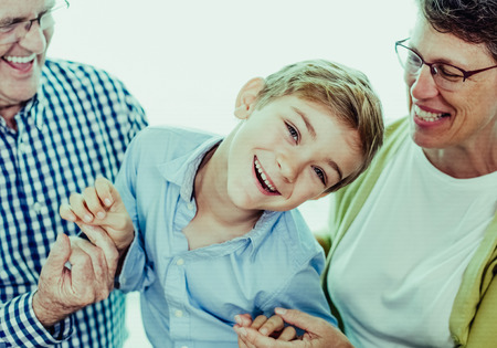 Playful Grandson Spending Time With Grandparentsの写真素材