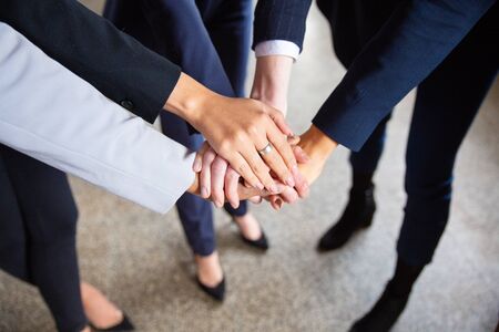 Cropped shot of women putting hands together in circle. Closeup shot of female hands. Teamwork...