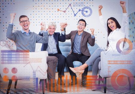 People celebrating success and virtual statistic graphics. Diverse cheerful businesspeople looking at camera and sitting in armchairs and sofa in loungeの写真素材