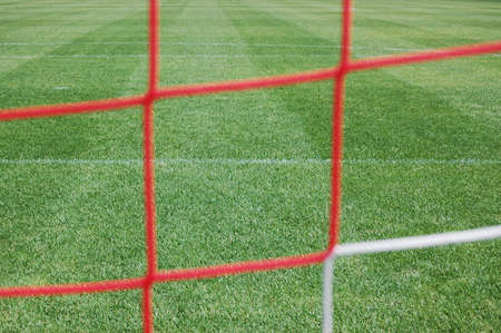 Type of a football field through a grid of gate の写真素材