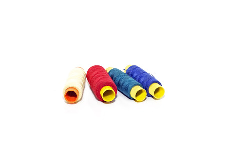 spools of thread four color isolated on white background