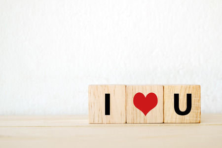 Three wood cubes with \" I love you \" wordsの写真素材