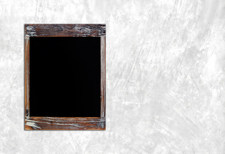 Blank vintage chalk board over cement wall background,templateの写真素材