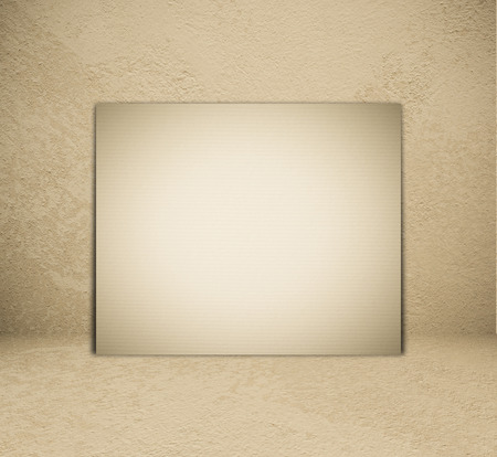 Blank vintage paper poster and brown cement room background, template.の写真素材