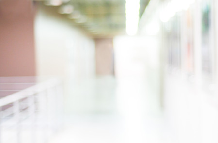 Blur inside office building with bokeh light background, interior and business background Blur inside office building with bokeh light background, interior and business background