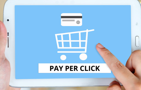 Pay per click on tablet screen backgroundの写真素材