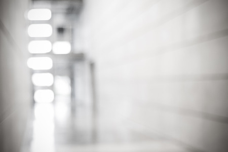 Blur inside office building with bokeh light background, interior and business backgroundの写真素材