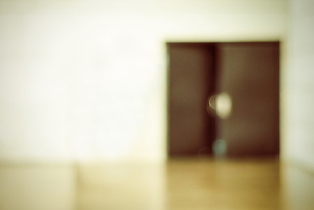 Blur opened door in office building with boken light background, business backgroundの写真素材