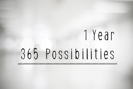 1 year 365 possibilities quotation on black and white abtract blur background