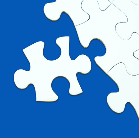 Jigsaw puzzle on blue background for business concepts template such as success, teamwork, E-commerceの写真素材