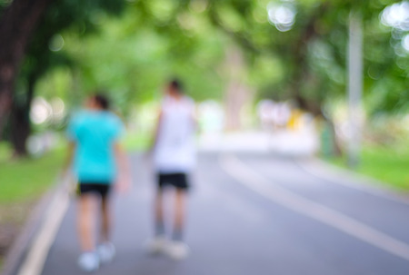 Blurred background of people activities in park with bokeh light, spring and summerの写真素材