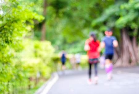 Blurred background of people activities in park with bokeh light, spring and summerの写真素材